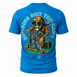A teal short-sleeve t-shirt shown from the back, featuring a large graphic print of a cartoon skull construction worker wearing an orange hard hat and holding a wrench, with the text 'BUILDING SHIT YOU CAN'T' arched above.