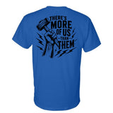 Blue t-shirt with black graphic and text on the back that says "There is more of us than them."