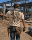  Tan t-shirt with a graphic saying "there's more of us than them."