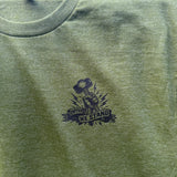 Olive Green t-shirt with a black graphic design on a textured fabric background